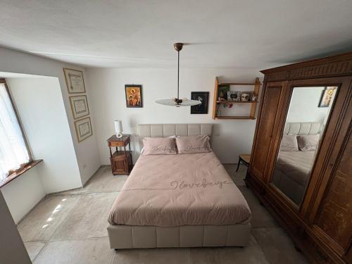 a bedroom with a large bed in a room at Raphael house in Gubbio