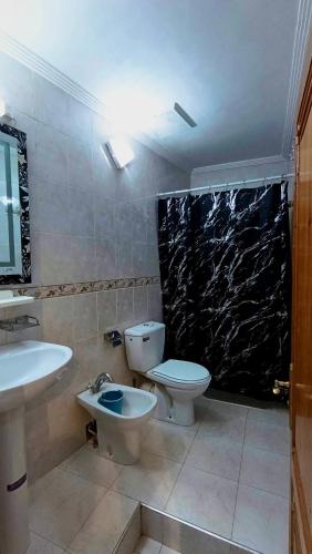 a bathroom with a toilet and a sink at Cozy Central Studio in Ifrane in Ifrane