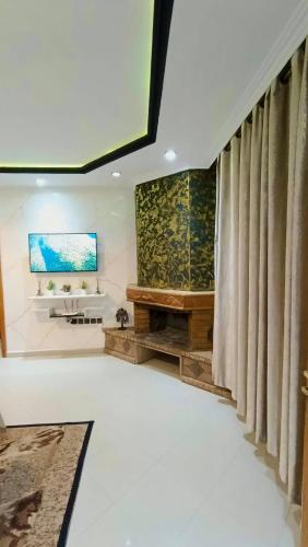 a living room with a skylight and a window at Cozy Central Studio in Ifrane in Ifrane