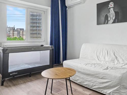 a living room with a couch and a table at Konstanzer12 - Free Parking Apt - AC in Iaşi