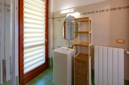 a bathroom with a sink and a mirror at Lake Iseo Panorama Suite in Tavernola Bergamasca
