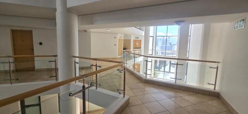 an empty room with a staircase in a building at Hibernian Towers 307 in Strand
