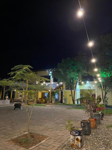 a small tree in a courtyard at night at Recanto Macambira in Delmiro Gouveia