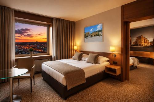 a hotel room with a bed and a large window at Cosmopolitan Bobycentrum - Czech Leading Hotels in Brno