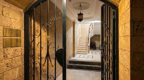 an entrance to a house with a wrought iron gate at Villa Golden Sunset Pyramids in Cairo