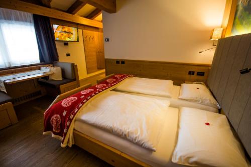 Una cama o camas en una habitación de Hotel Cirelle Suite & Spa