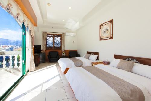 Postel nebo postele na pokoji v ubytování Chun Feng Cao Tang Homestay