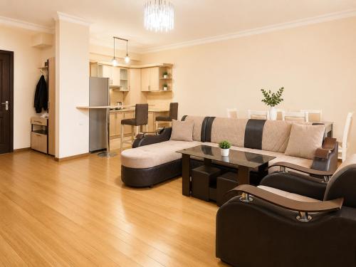 a living room with a couch and a table at Republic Square Apartment in Yerevan