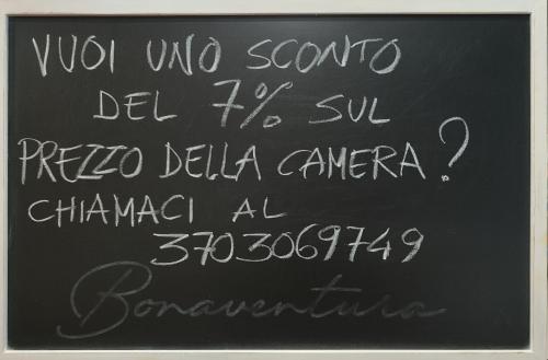 a chalk writing on a blackboard with writing on it at Bonaventura b&b and Bonaventura food in Tollo