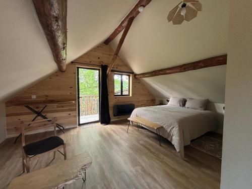 a bedroom with a bed in a attic at Clos Lavaux in Châtenay