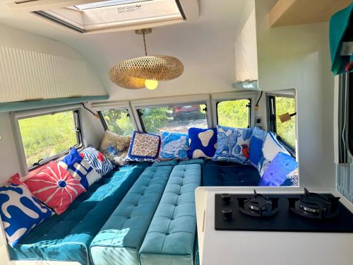 a couch in the back of a rv at Boho luxury caravan in Kisapáti