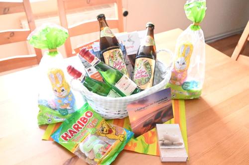a basket filled with bottles of champagne on a table at FEWO RENKEN in Trassenheide