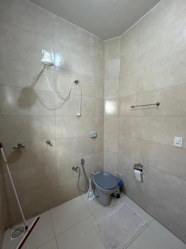 a bathroom with a shower with a toilet in it at Apartamento 2 quarto e garagem G para 2 carro in Rio Verde