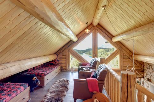 a room with a large window in a log cabin at Durango Mountain Escape w/ Stunning Views in Durango