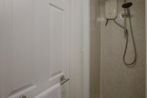 a bathroom with a shower with a shower at 1 Bed in St. Ives oc-pc466a in St Ives