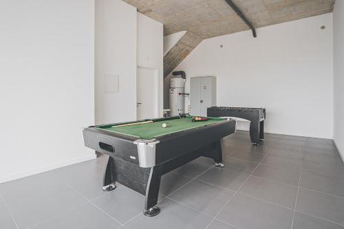 a room with a pool table in a room at Villa Delfina with private pool in Mariquiteira