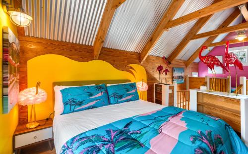 a bedroom with a bed in a room with wooden ceilings at Tickle Me Tides in Inlet Beach