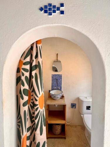 a bathroom with a sink and a toilet at Dar Hallouma - WostelDjerba community in Djerba