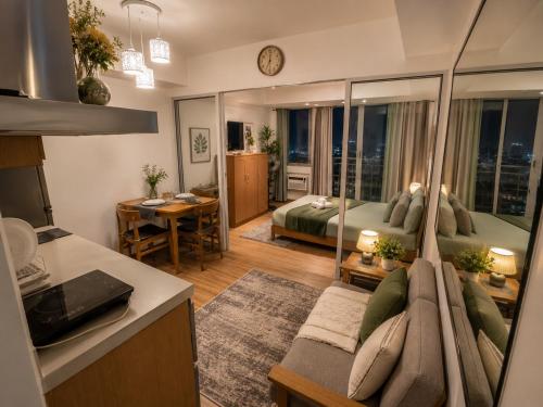a living room with a bed and a couch at Azure Urban Resort Residences by Value Suites in Manila