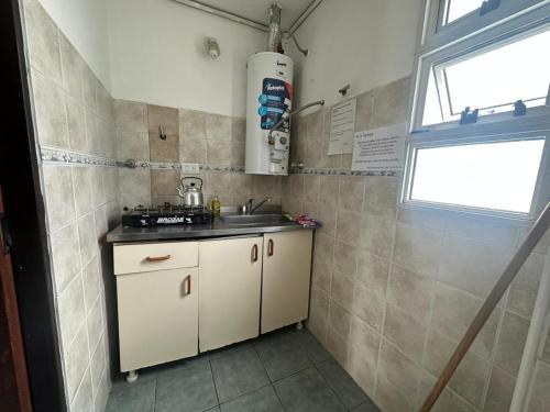 a small kitchen with a sink and a window at Lass Cahuelas in Federación