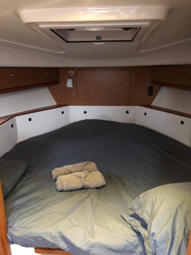 a bed in the back of a boat at Escapade Antiboise avec parking inclus in Antibes