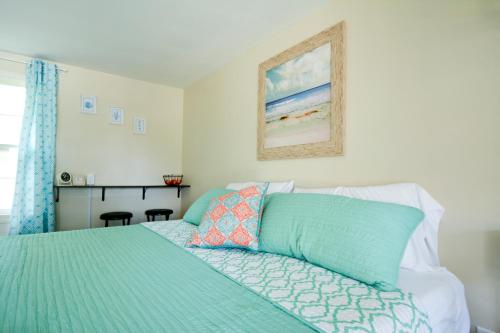 a bedroom with a bed with a green comforter at Whitehall Cottages in Whitehall