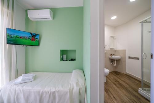 a hospital room with a bed and a bathroom at hotel La pineta in Marina di Carrara