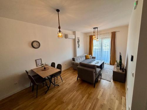 a living room with a table and a couch at Montenegro Suite Rental in Bar