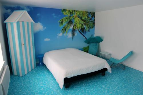 a bedroom with a bed and a palm tree mural at L'inattendu in Les Piards
