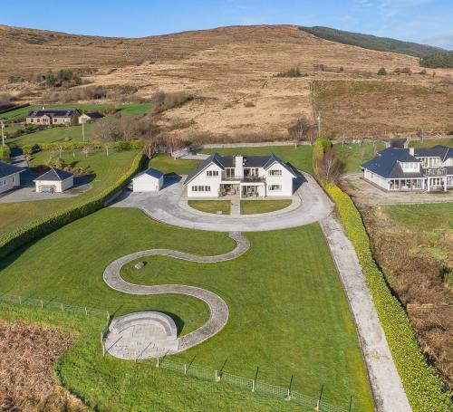 an aerial view of a house with a winding driveway at The Iveragh in Kenmare