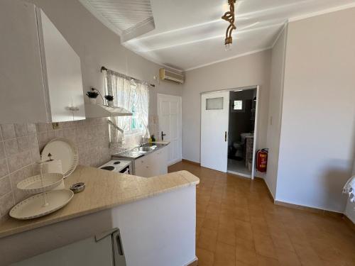 a kitchen with a sink and a counter top at Razos Windmill in Vathi