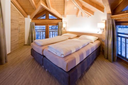 Säng eller sängar i ett rum på Appartement Haus Sonntal