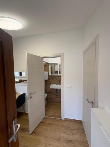 a bathroom with a toilet and a sink in a room at Babina Hiža in Pula