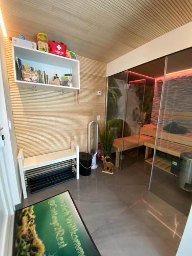 a room with a room with a bench and a bed at Cottage2Rest in Erbach