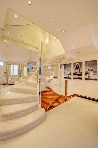 a staircase in a house with a glass wall at MariaHilferHome in Vienna