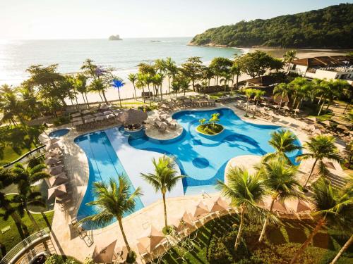 an aerial view of the pool at the resort at Hotel Jequitimar Guaruja Resort & Spa by Accor in Guarujá