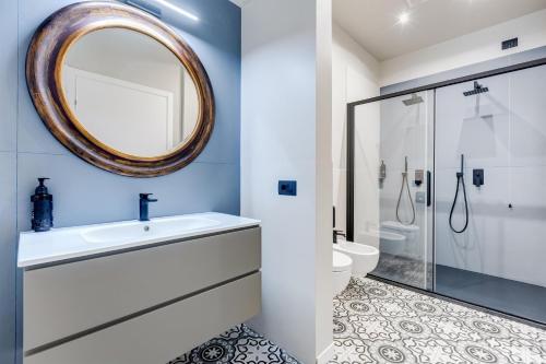 a bathroom with a sink and a mirror at Best Western Plus Fontana Falconieri Hotel in Messina