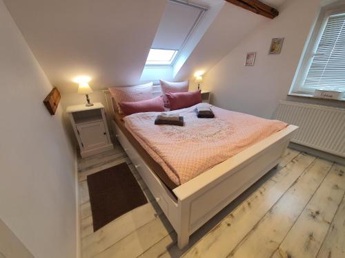 a bedroom with a bed with two lamps on it at Friendly Home - "Helles Dachstudio" Köln Bonn Phantasialand in Bornheim
