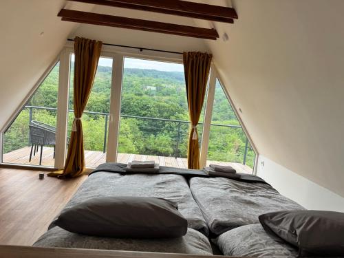 Llit o llits en una habitació de Rejtek Panoráma