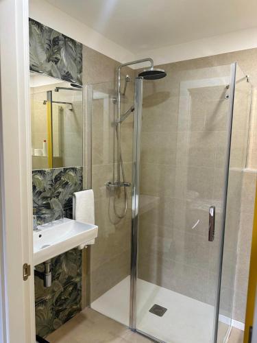 a bathroom with a shower and a sink at Pensión Ariz in Basauri