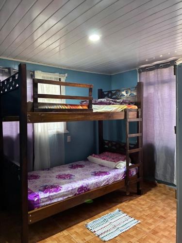 a bedroom with two bunk beds in a room at Golden Jungle Hideaway in Salado