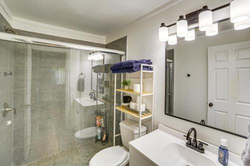 a bathroom with a toilet and a sink and a shower at Fire Pit & Stunning Lake Views: Shell Knob Home! in Shell Knob