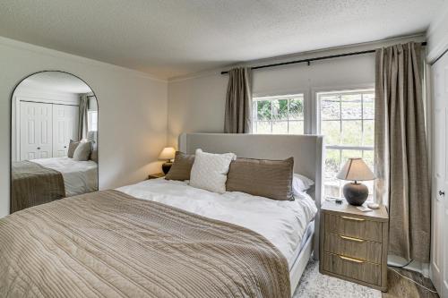 a bedroom with two beds and a large window at Fire Pit & Stunning Lake Views: Shell Knob Home! in Shell Knob