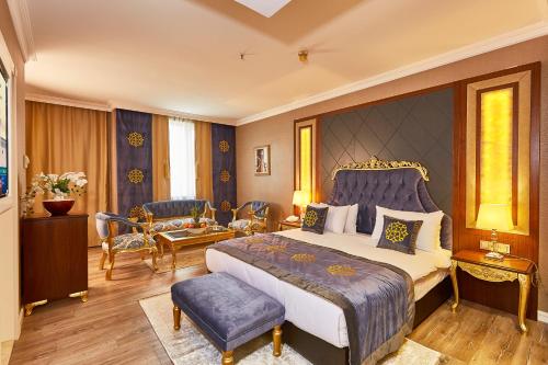a bedroom with a king sized bed and a living room at Seres Hotel Old City in Istanbul
