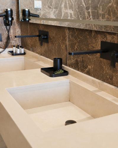 a bathroom with a sink with a soap dispenser at Al Capri Suite & Private Pool in Capri