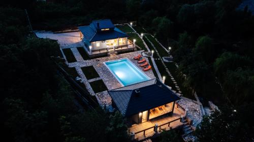 an overhead view of a house with a swimming pool at Villa Vrelo Oasis in Malo Polje