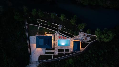 an aerial view of a house at night at Villa Vrelo Oasis in Malo Polje