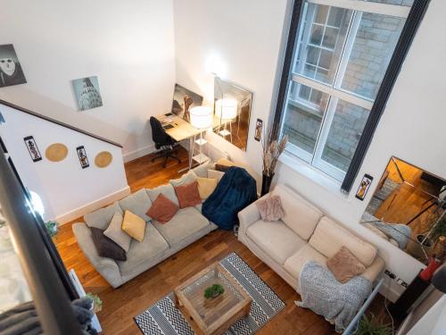 an overhead view of a living room with a couch at Sheffield City Centre Large Luxury Apartment Sleeps 4 in Sheffield