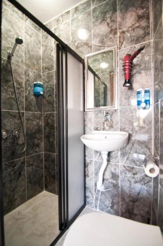 a bathroom with a shower and a sink at Terrace Hotel in Istanbul