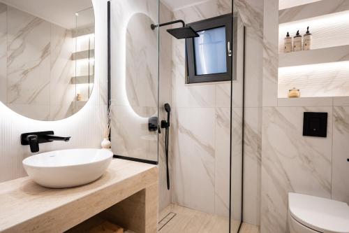 a bathroom with a sink and a shower at Capo Davia seaside Villa in Argassi
